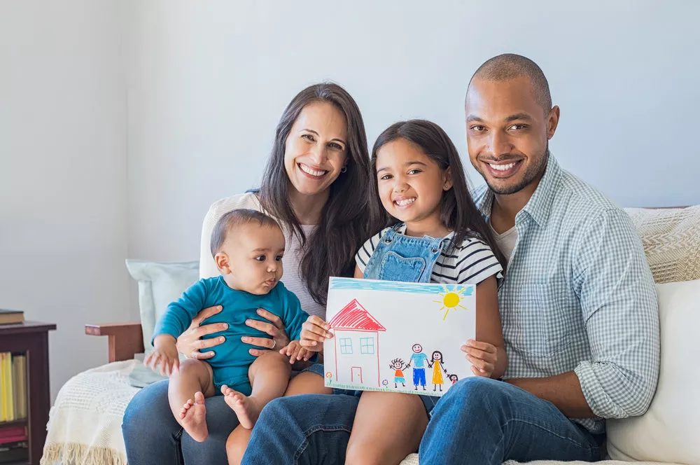 Adult and children sitting on the couch