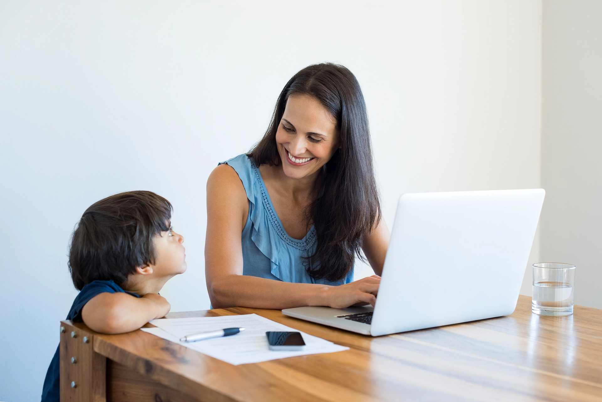 Happy mother talking to child